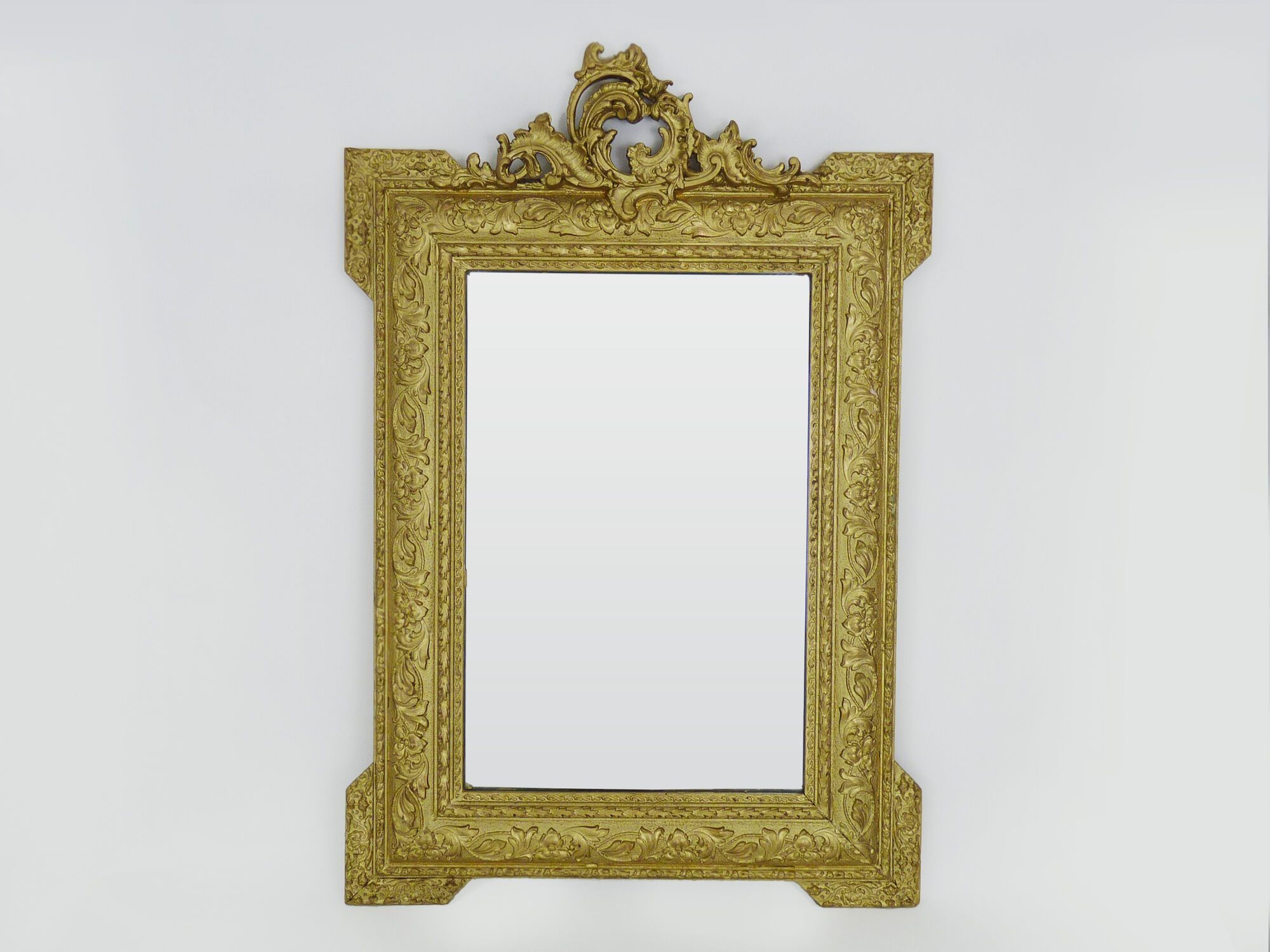 Old wall mirror in wood and gilded stucco, Louis XVI style. XIXth