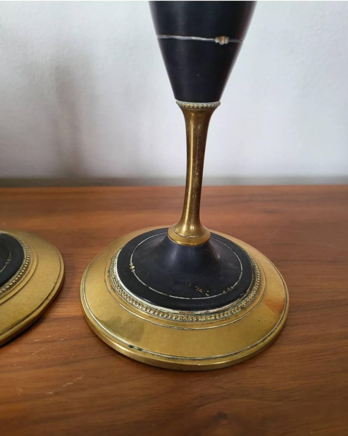 Pair of brass and black hard stone candlesticks