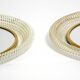 Pair of Mid Century wall mirrors with brass rim and white metal frames
