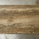 Table basse travertin et laiton