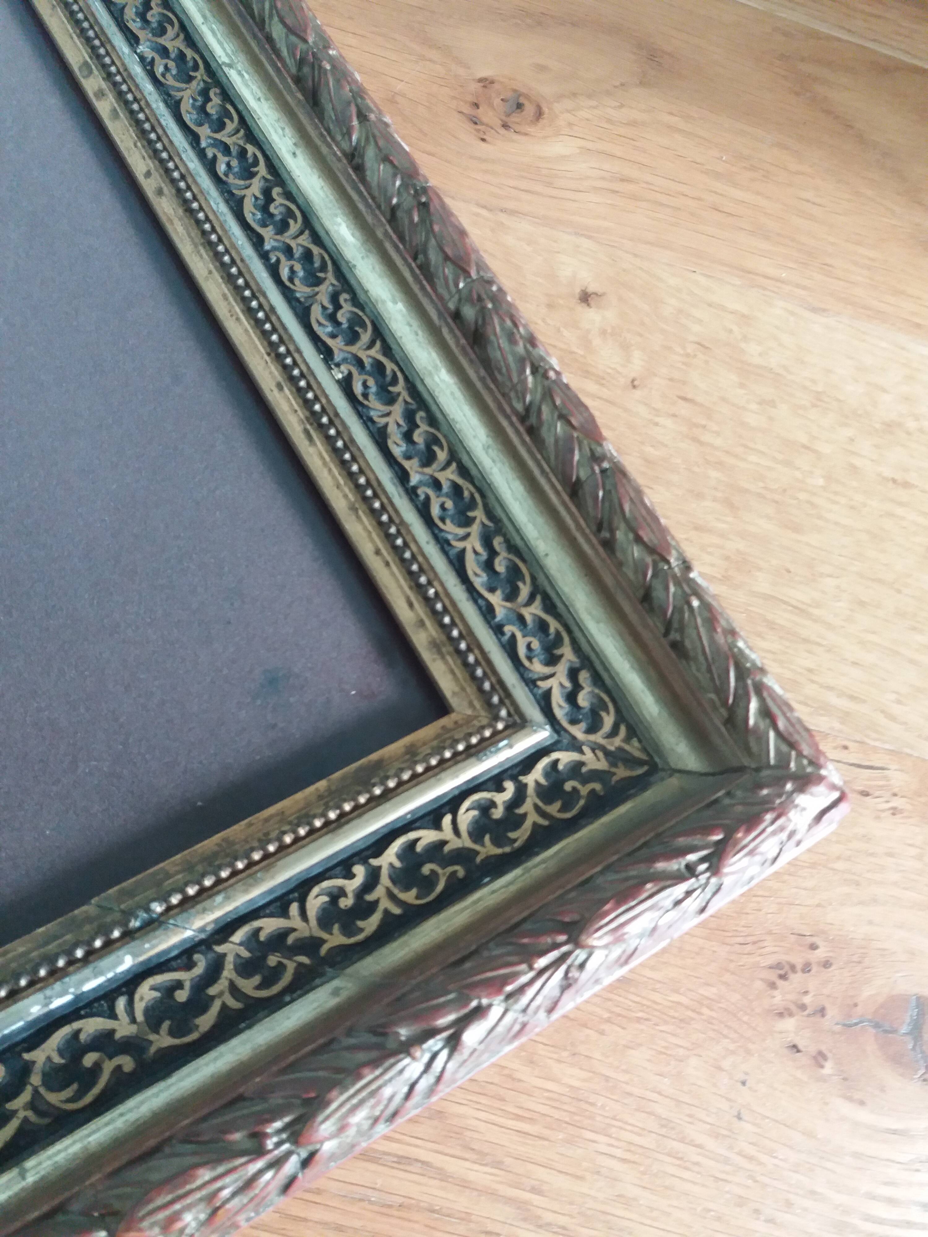 Old photo portrait framed in wood and stucco