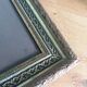 Old photo portrait framed in wood and stucco