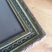 Old photo portrait framed in wood and stucco