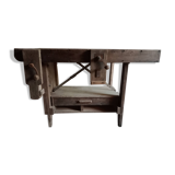antique workbench with one drawer and two vices