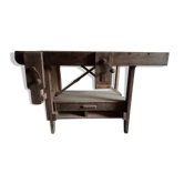 antique workbench with one drawer and two vices