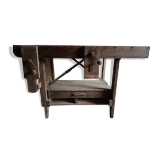antique workbench with one drawer and two vices