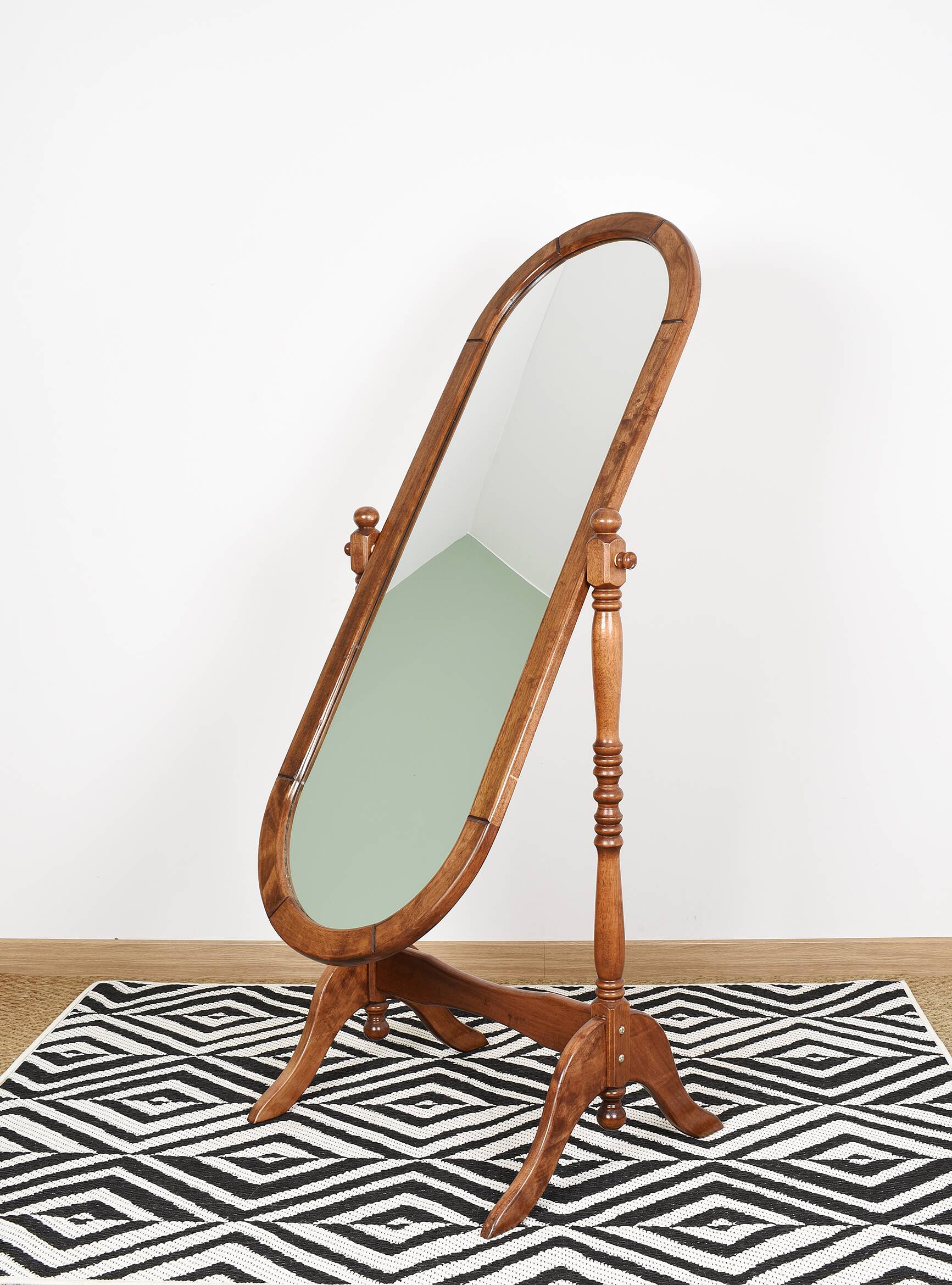 Large psychic mirror on legs with pivoting oval frame.