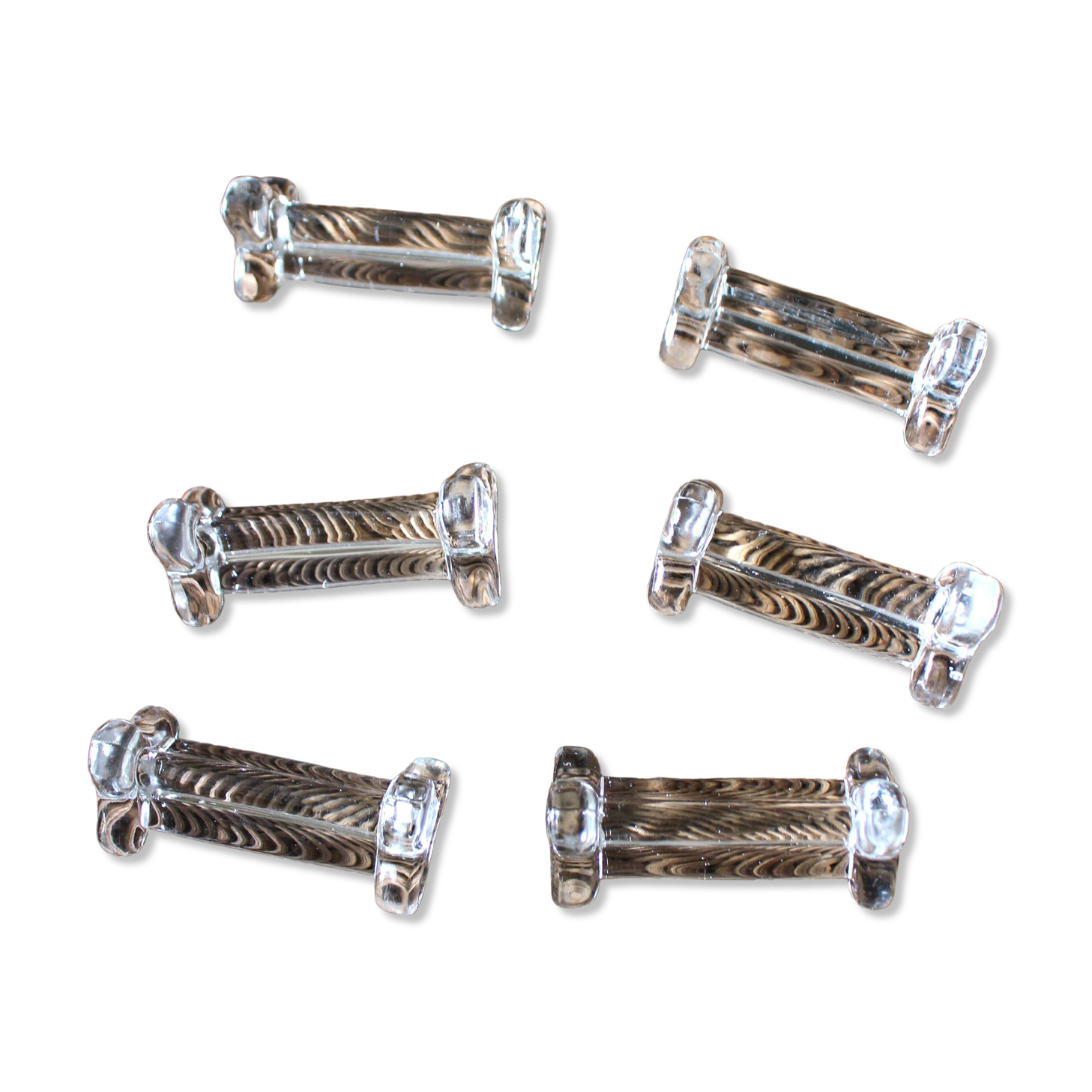 A set of 6 transparent trilobite glass knife rests.