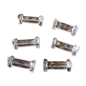 A set of 6 transparent trilobite glass knife rests.