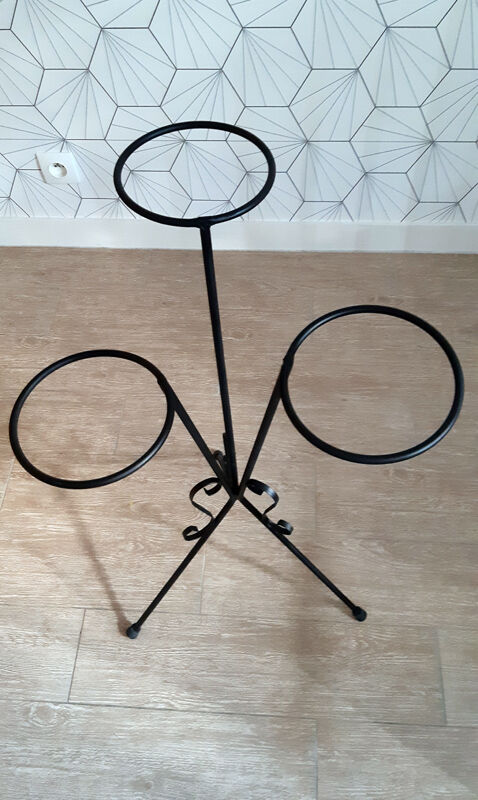 Plant holder in black wrought iron.