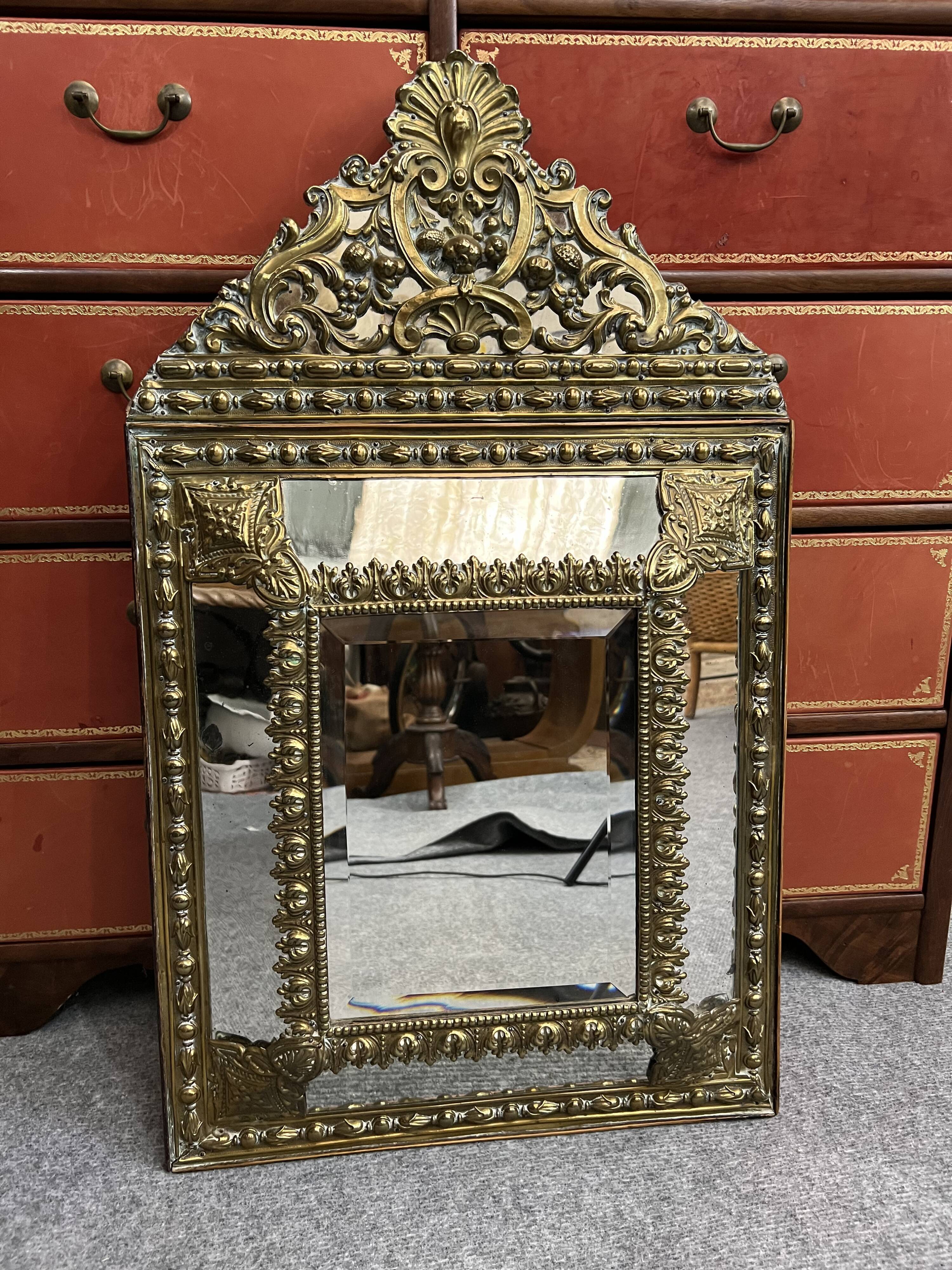 Old repoussé brass pareclose mirror