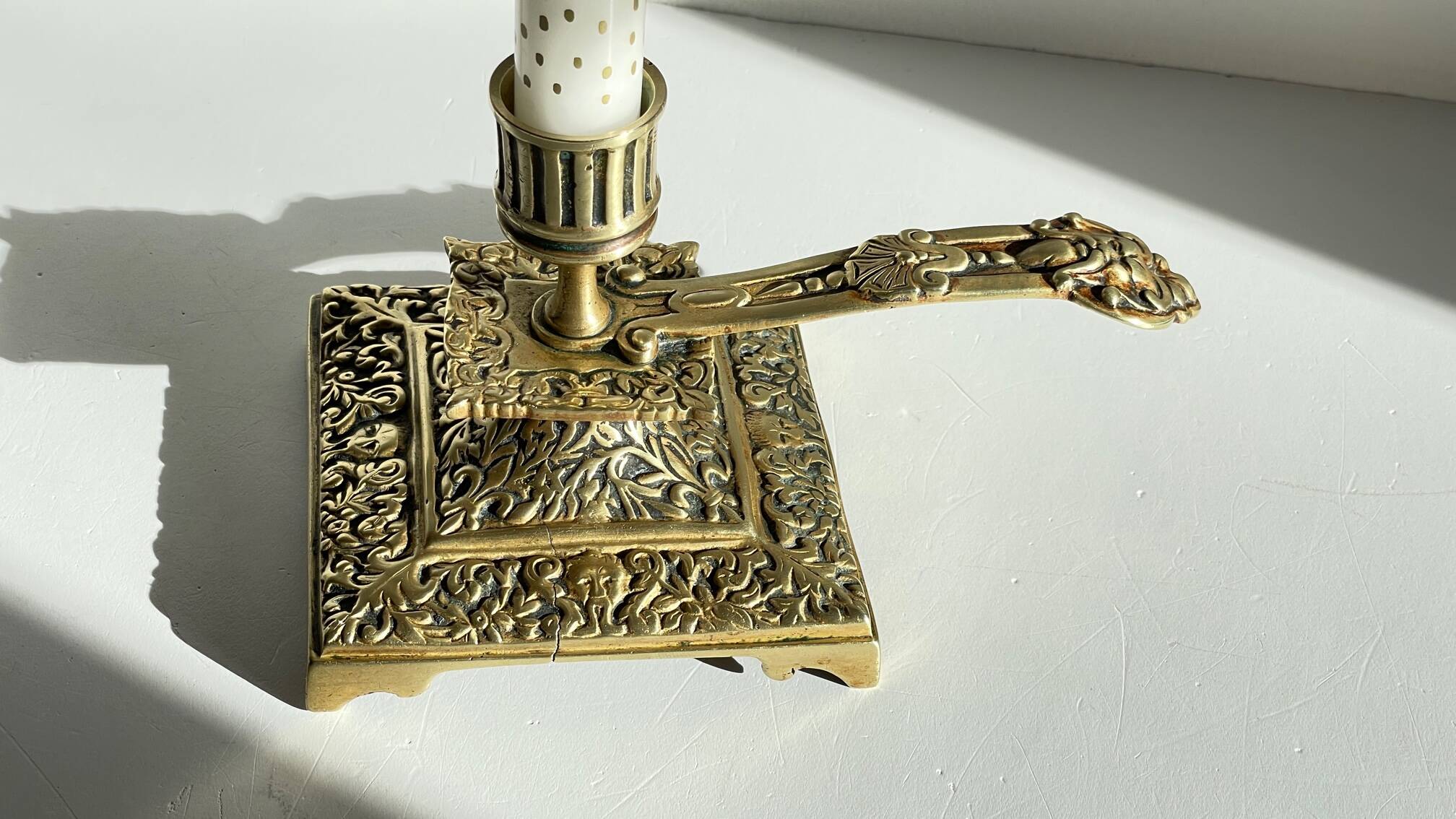 Patterned solid bronze hand candle holder