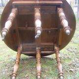 Old solid oak round table, diameter 115cm 6 feet on wheels