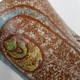 Accolay décor of face ceramic vase