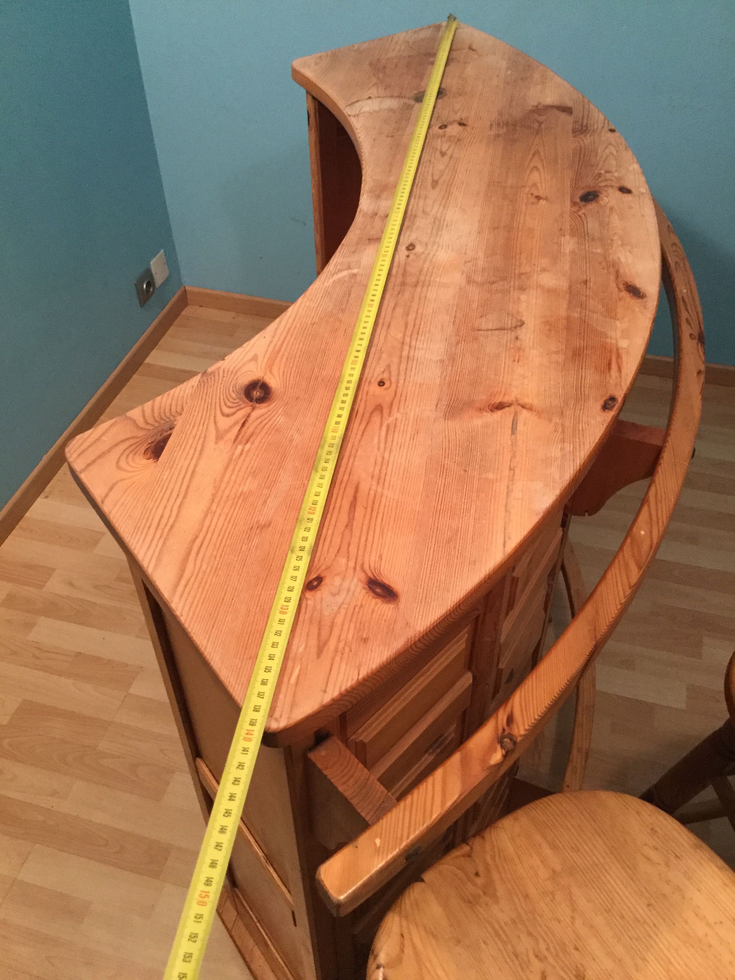 Vintage bar counter with natural wood stools