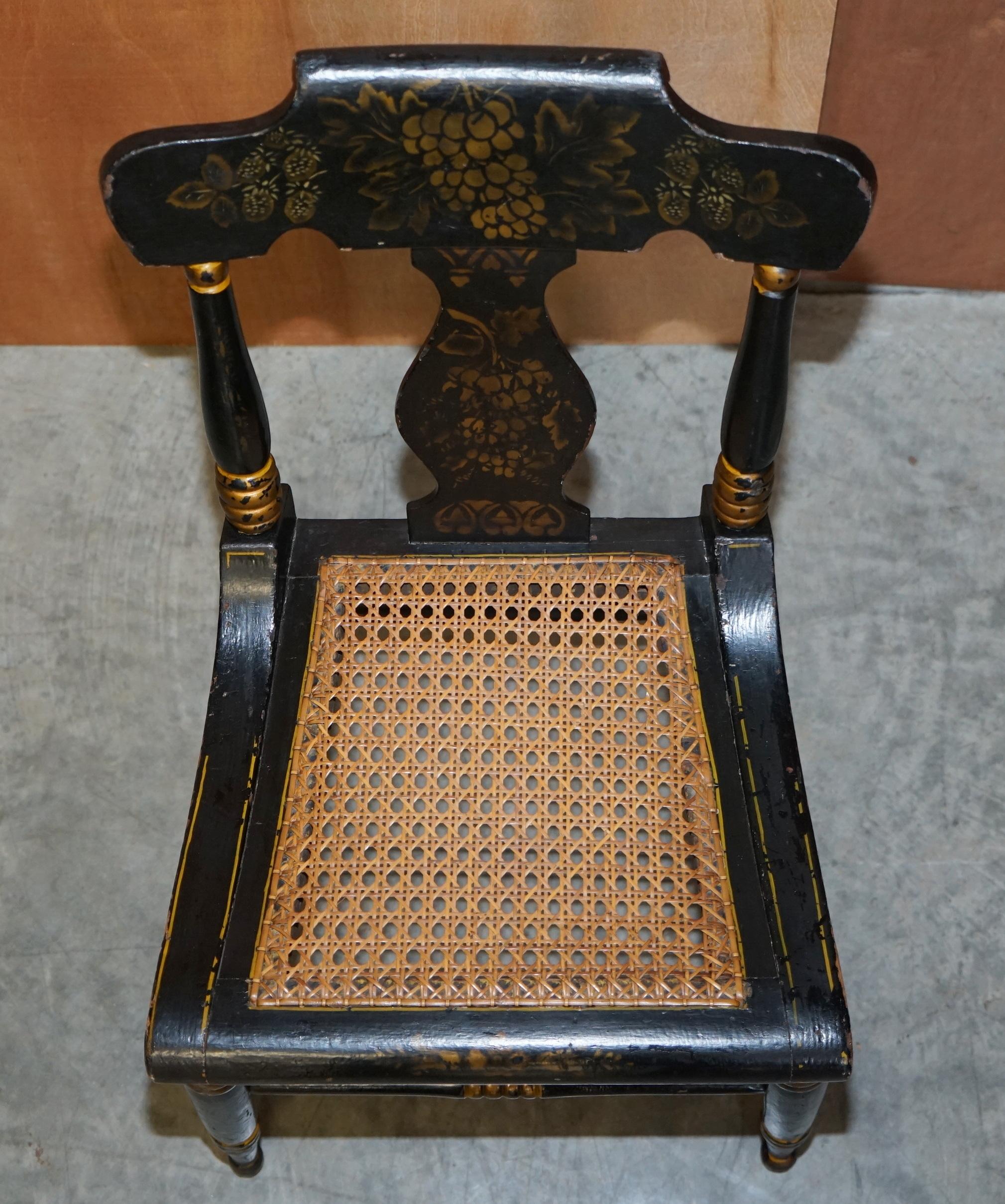Georgian side bergère circa 1825, ebonised and hand-painted in Baltimore style.