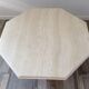 Octagonal coffee table in travertine