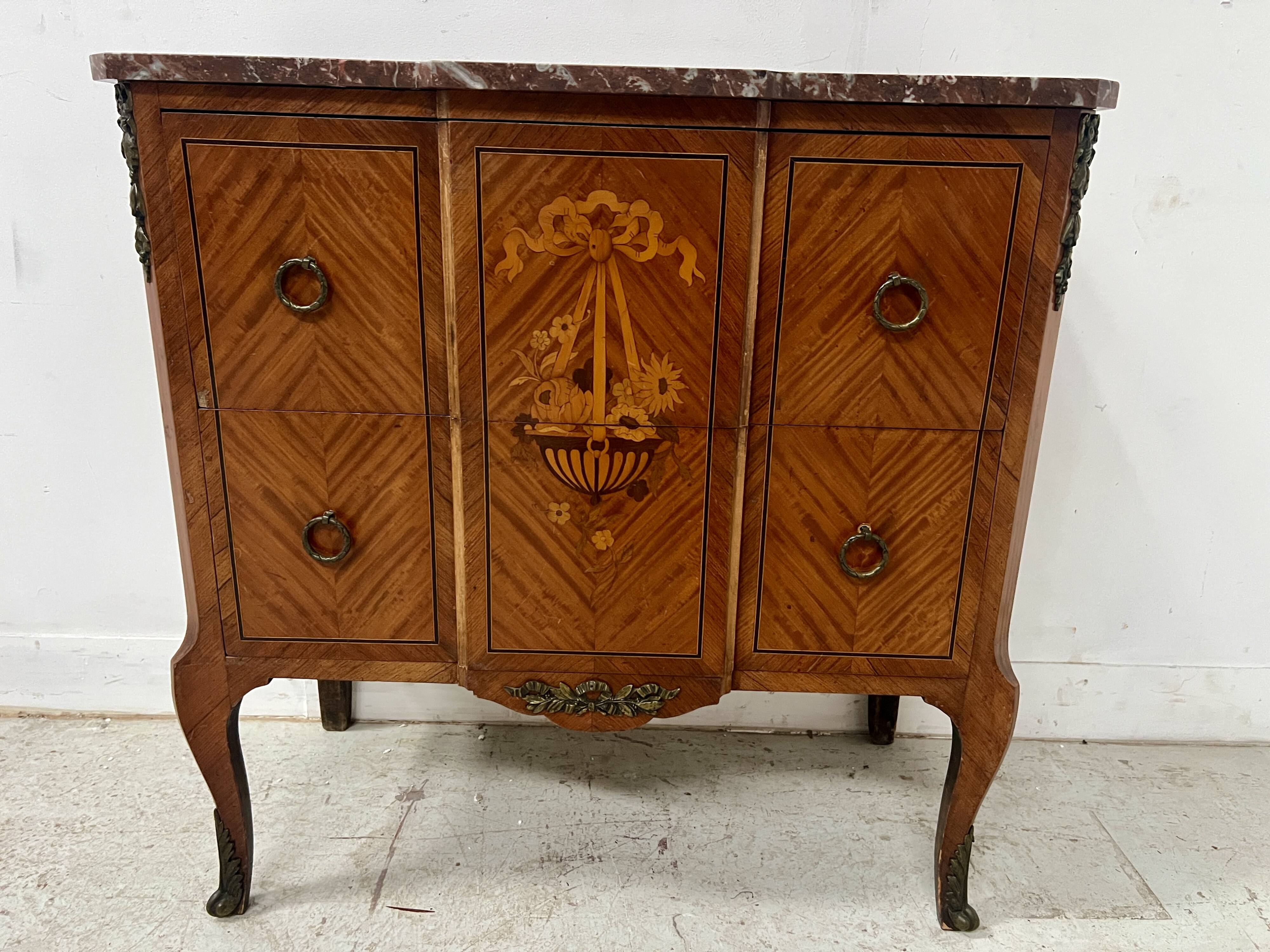 Transitional style commode with a protruding front, in marquetry wood, 20th century.