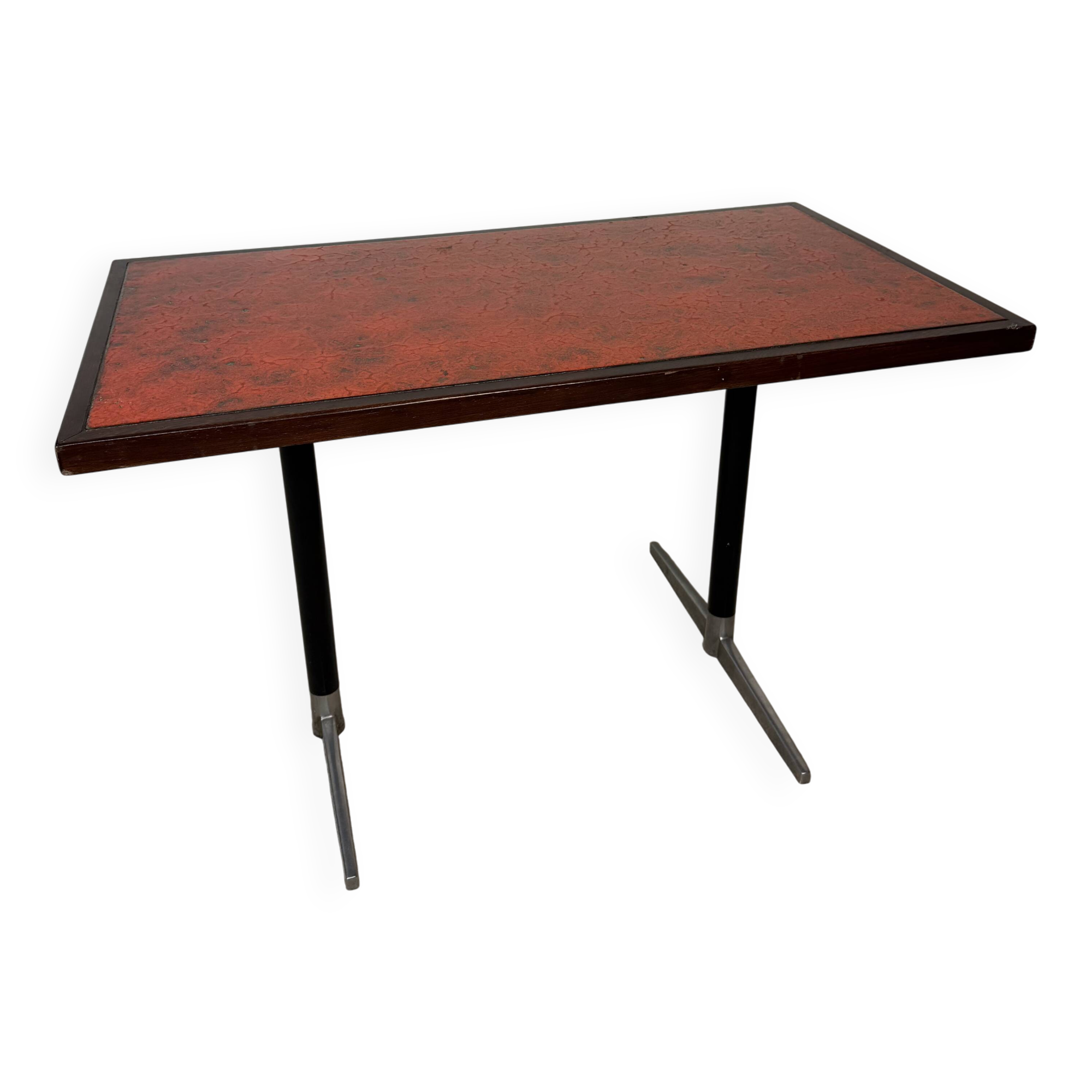Vintage bistro table with orange-red ceramic.