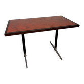 Vintage bistro table with orange-red ceramic.