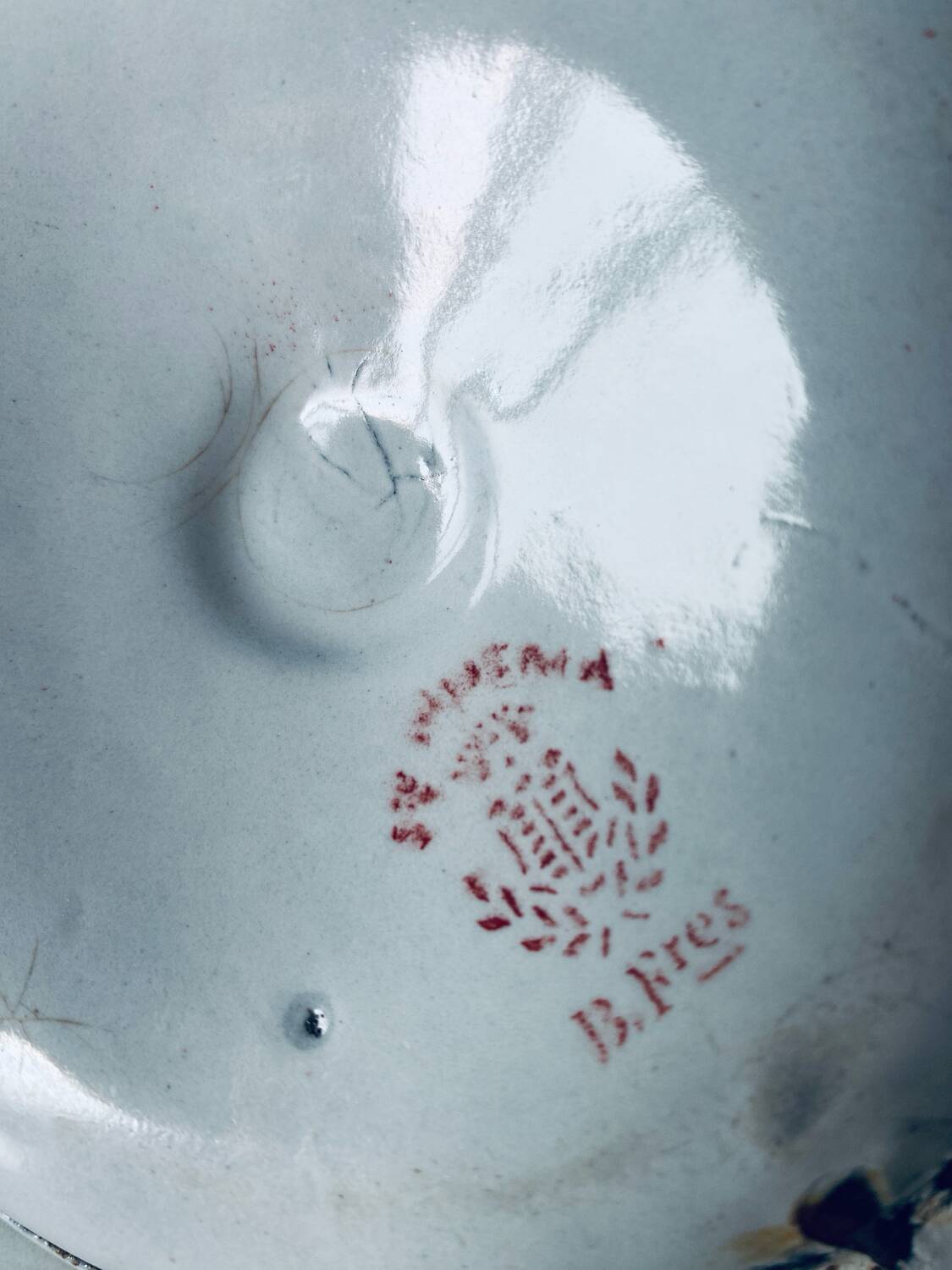 Antique enamelled metal candle holder