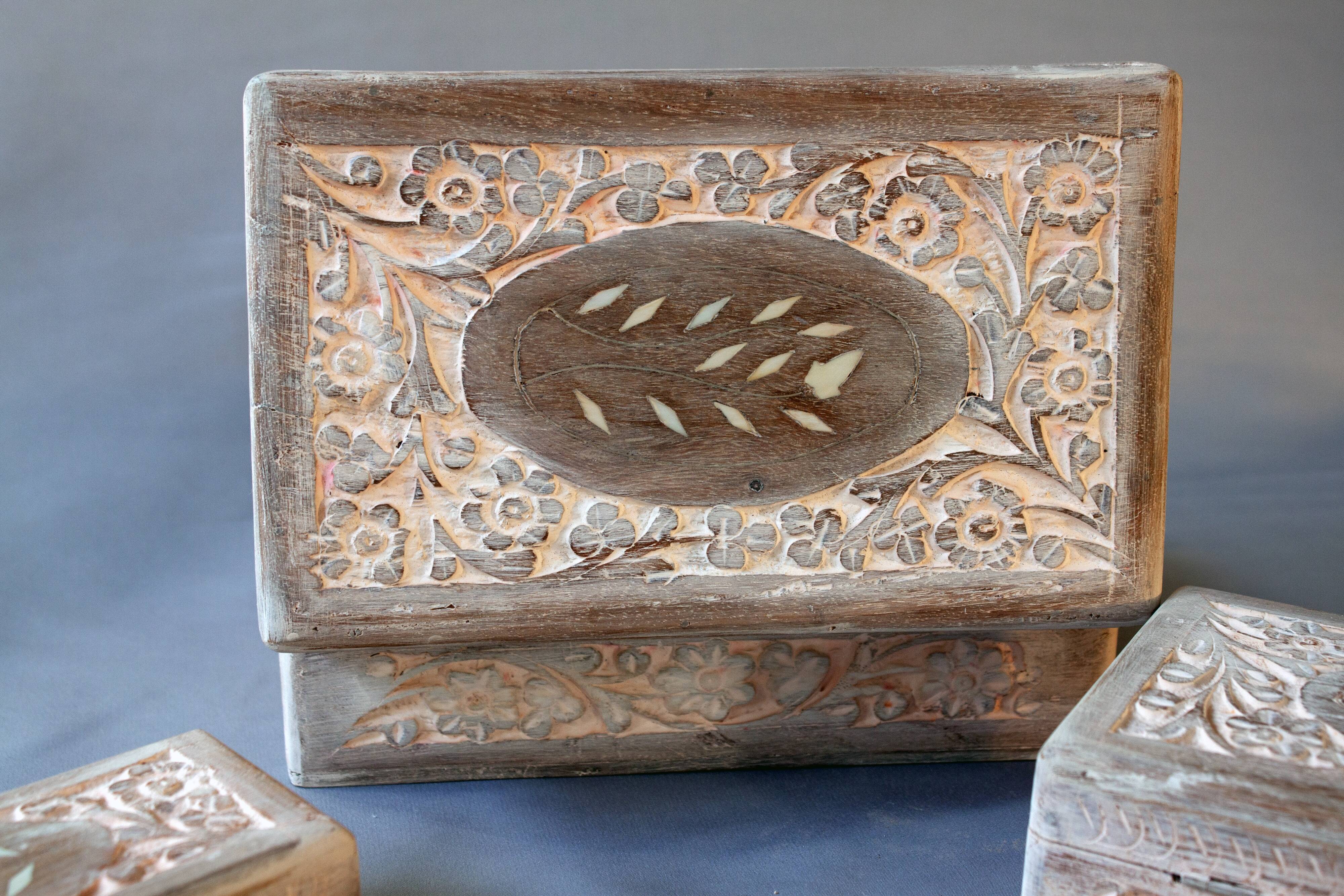 Hand-carved wooden boxes with ivory inlays