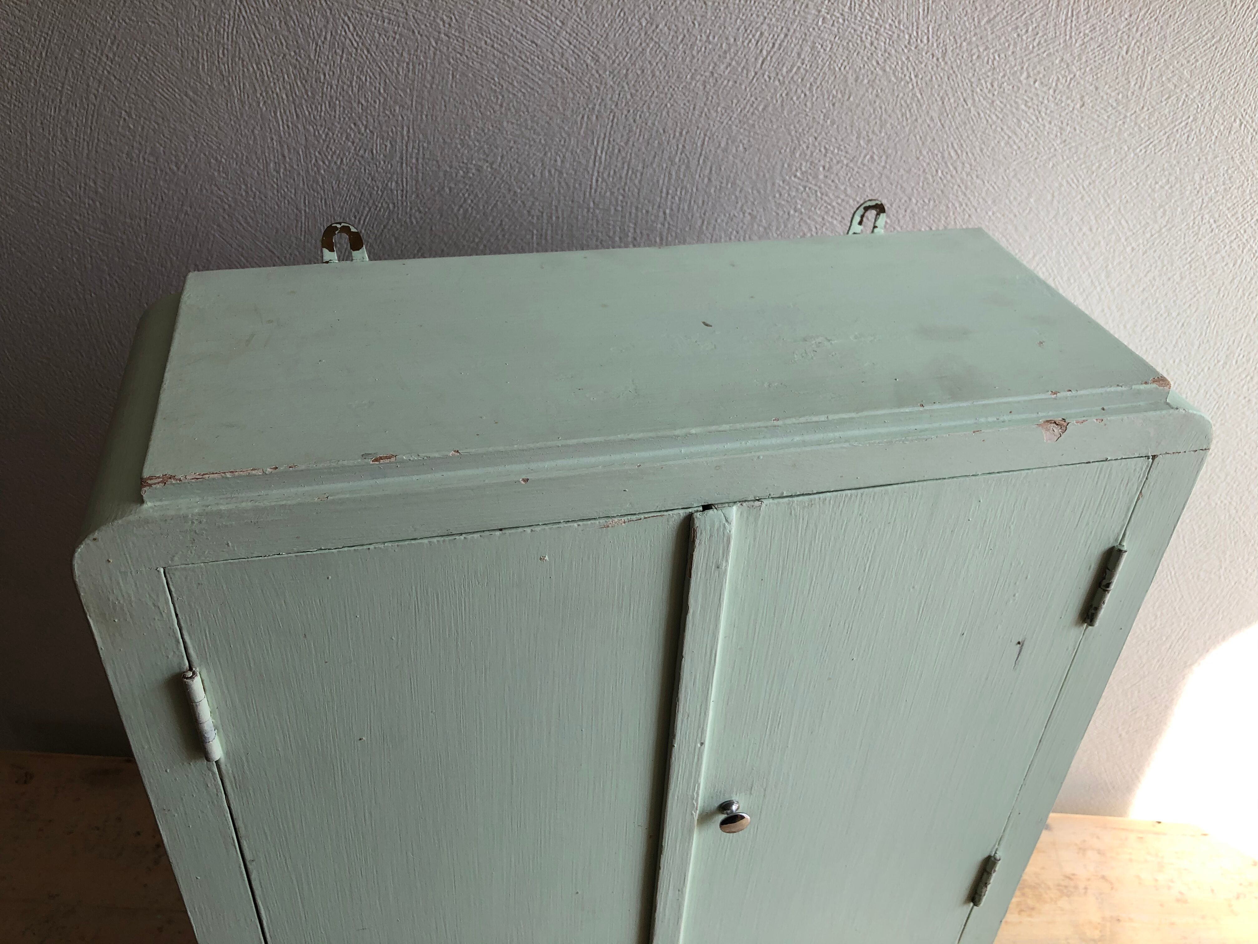 Patinated medicine cabinet