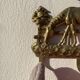 Hook for keys or tea towels in gilded brass with carved horse decoration