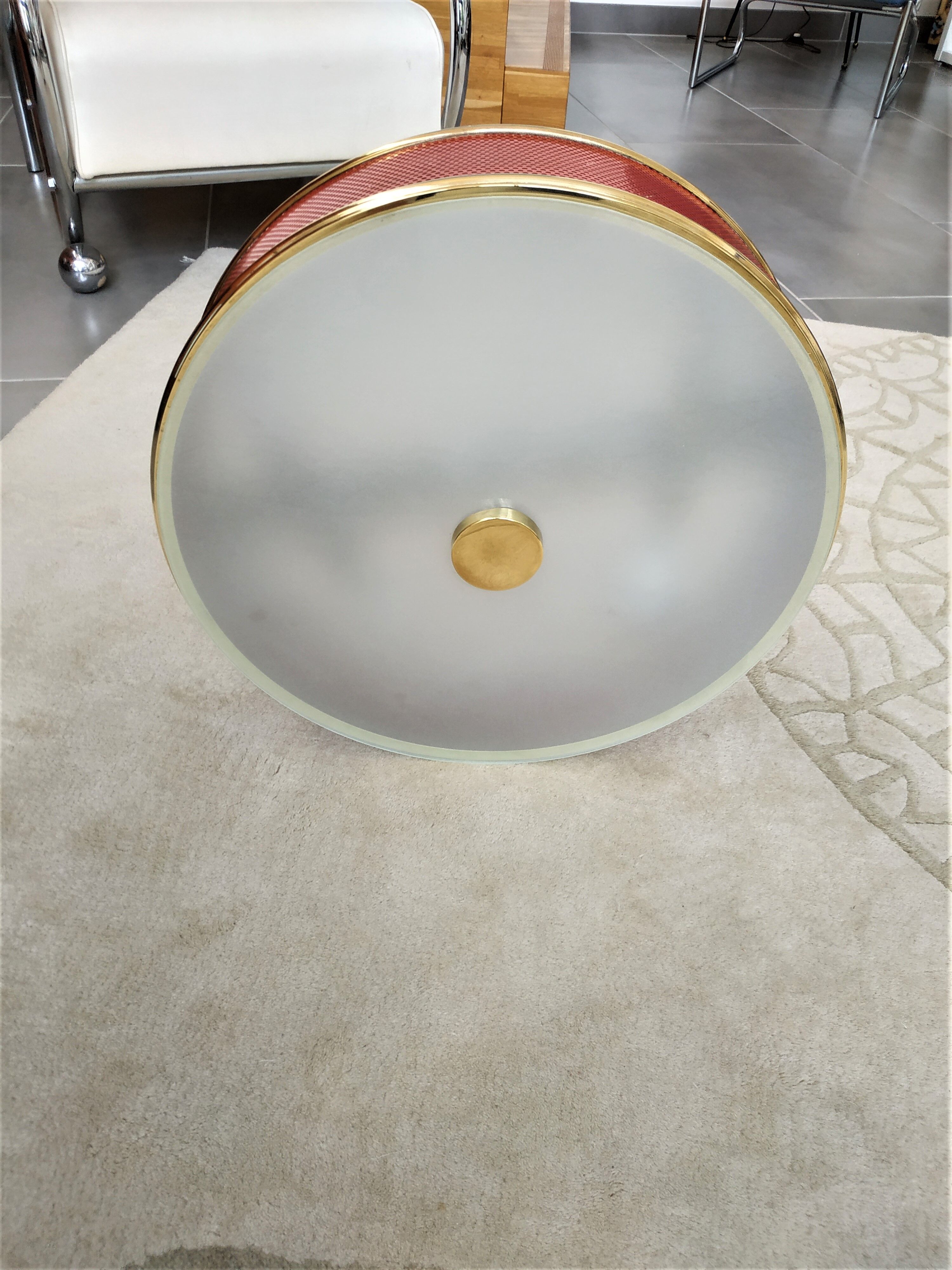 Ceiling lamp applied in red lacquered perforated metal