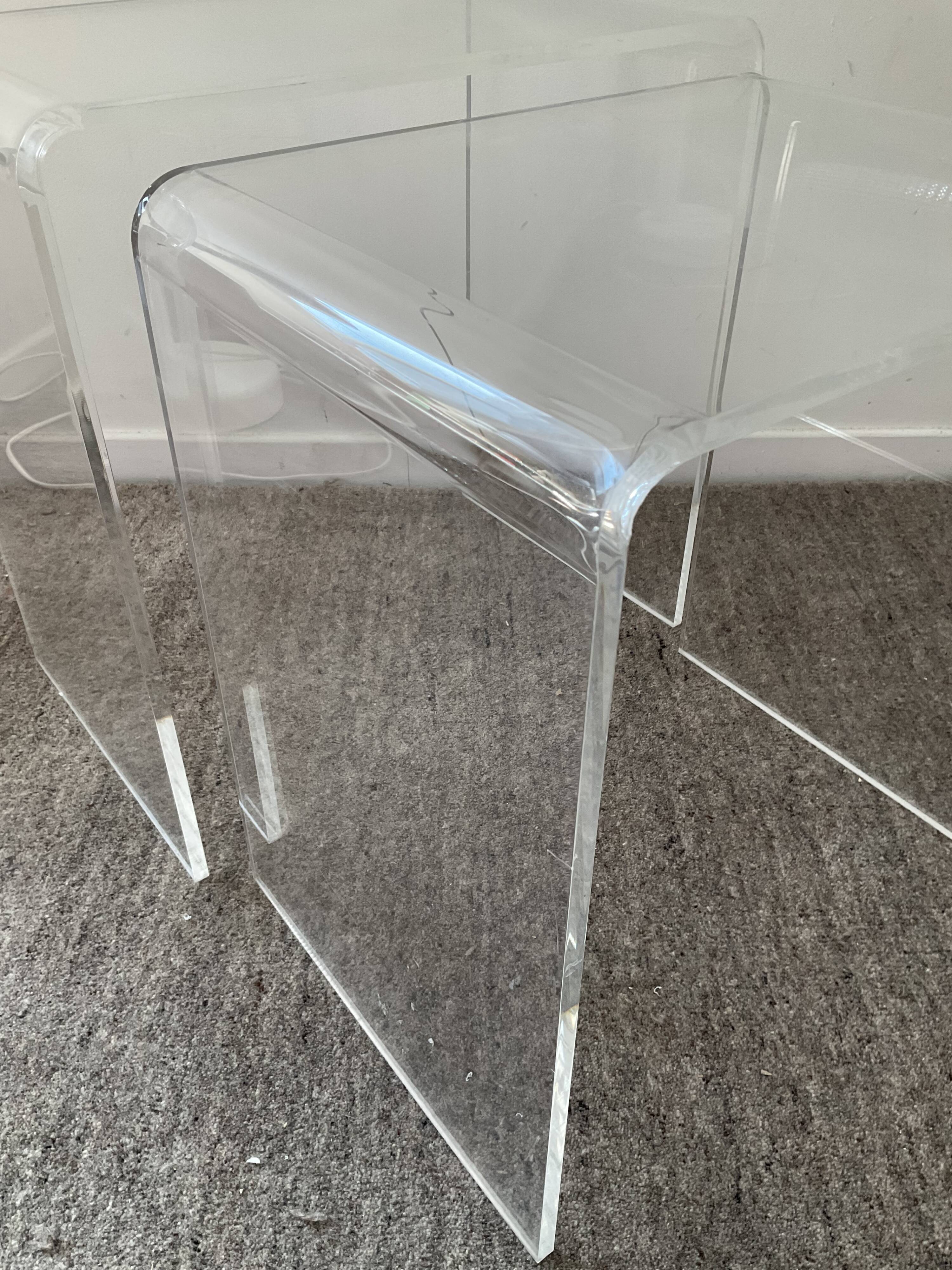 Duo of pull-out tables in plexiglass 70s