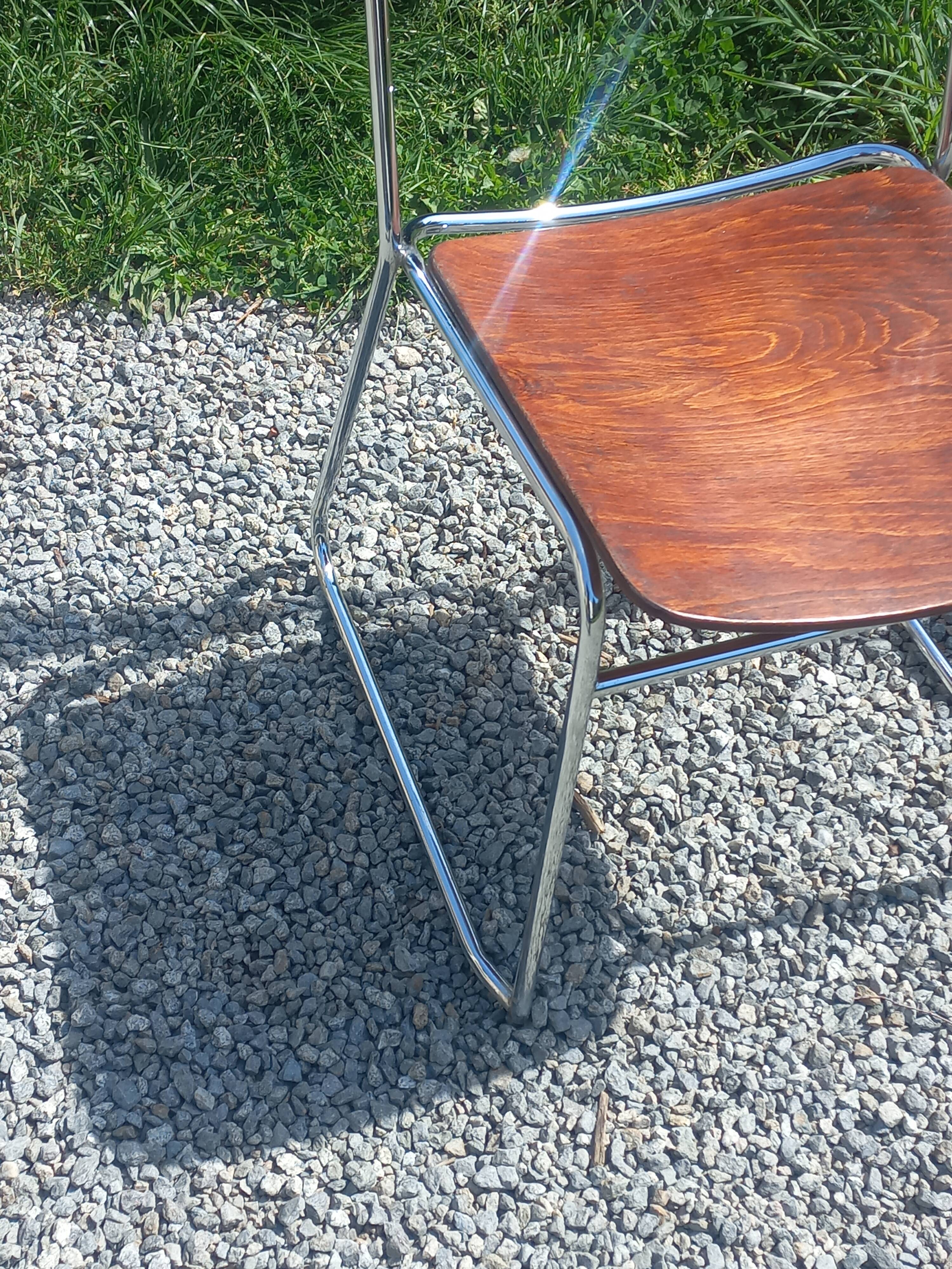 Pair of 1970s designer chairs in chrome metal and wood.