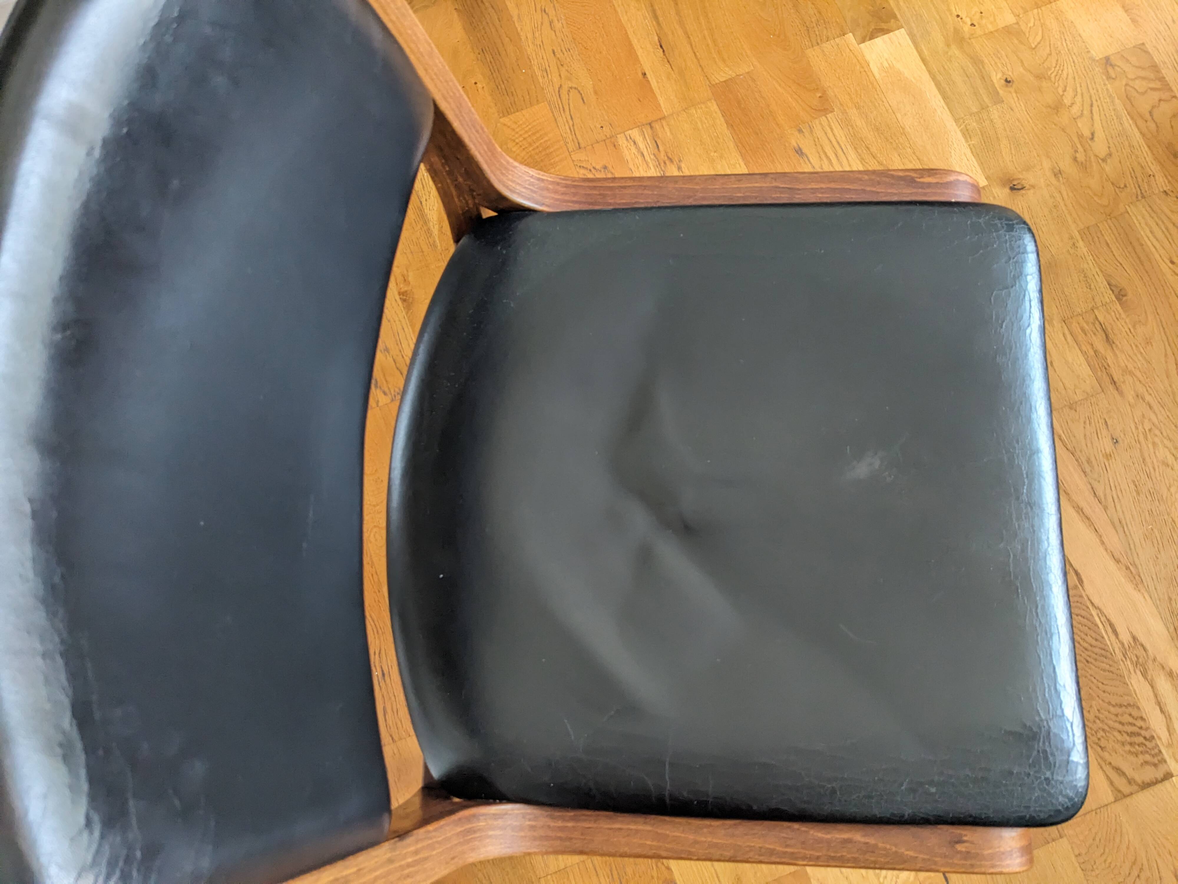 Vintage leather and wood chair pair
