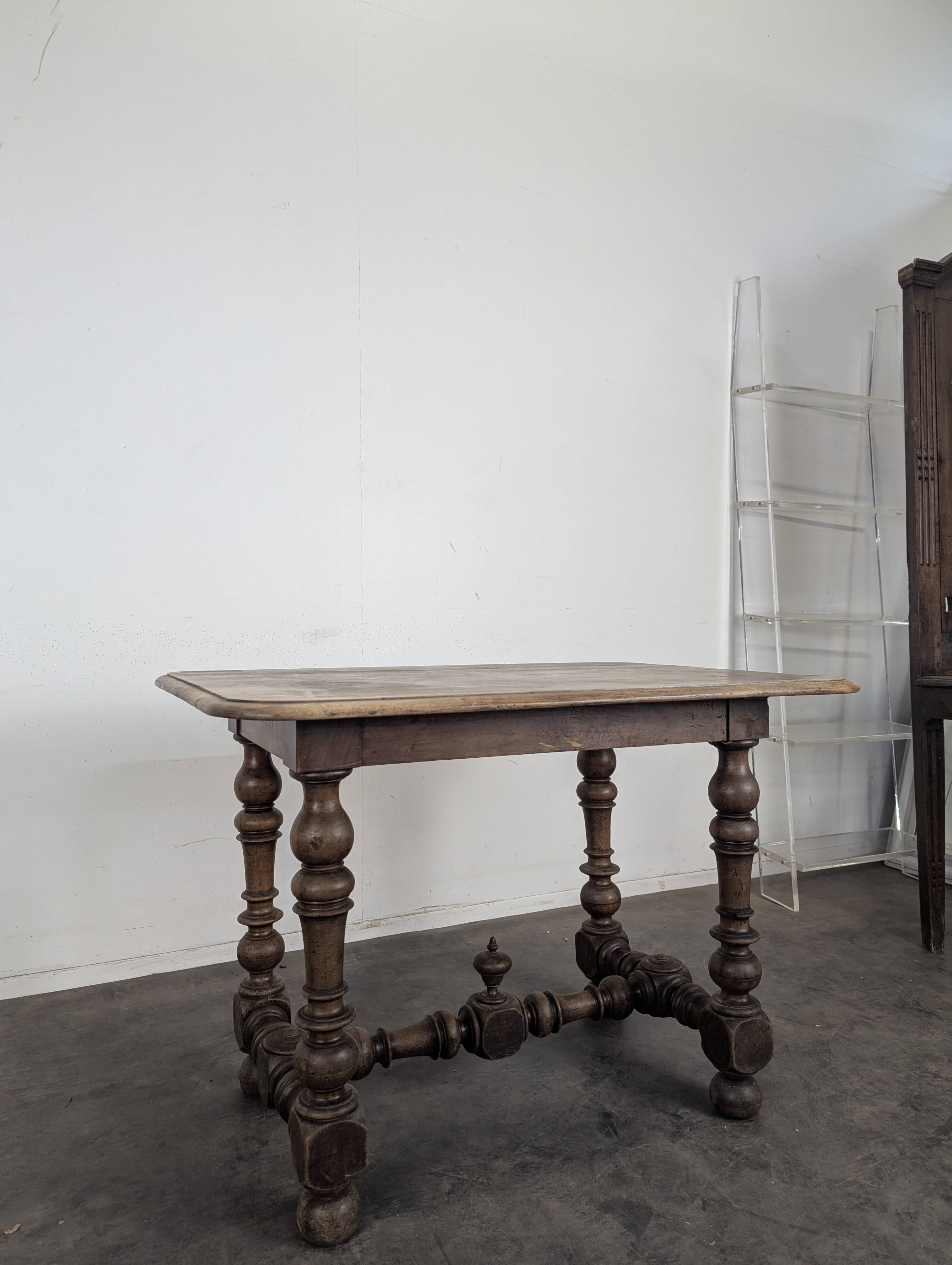 Louis XIII oak table with baluster legs and H stretcher.