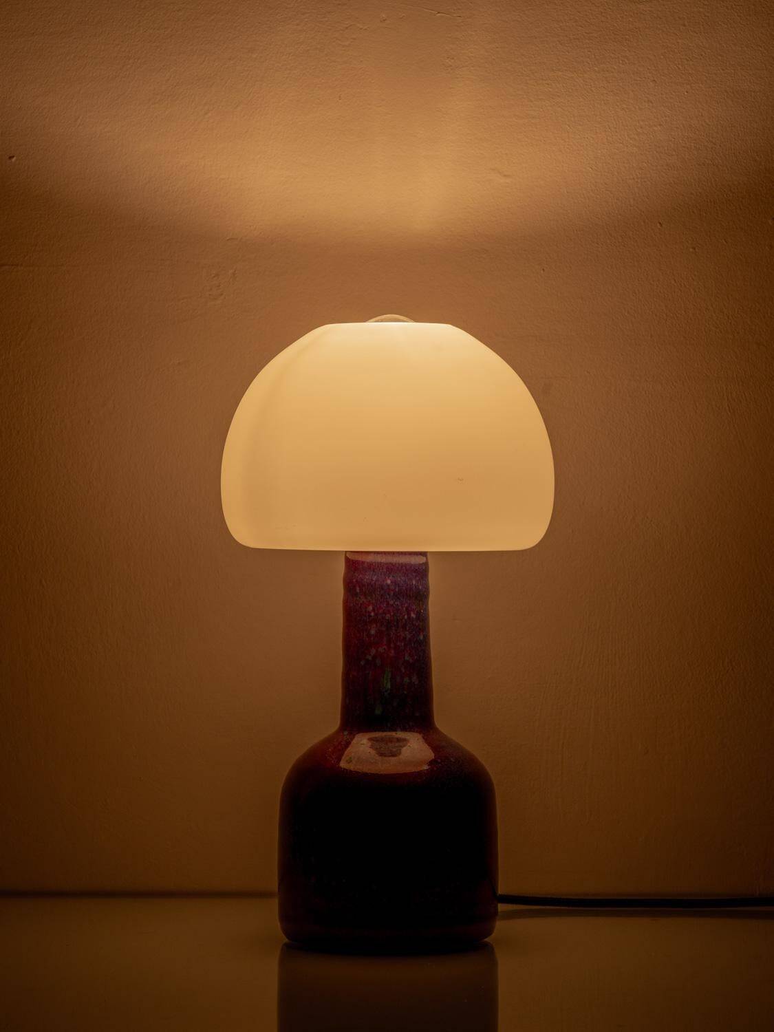 Mid-century modern table lamp by Jaap Ravelli, ceramic base and glass shade.