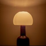 Mid-century modern table lamp by Jaap Ravelli, ceramic base and glass shade.