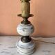 Round lamp base in white patina wood and brass