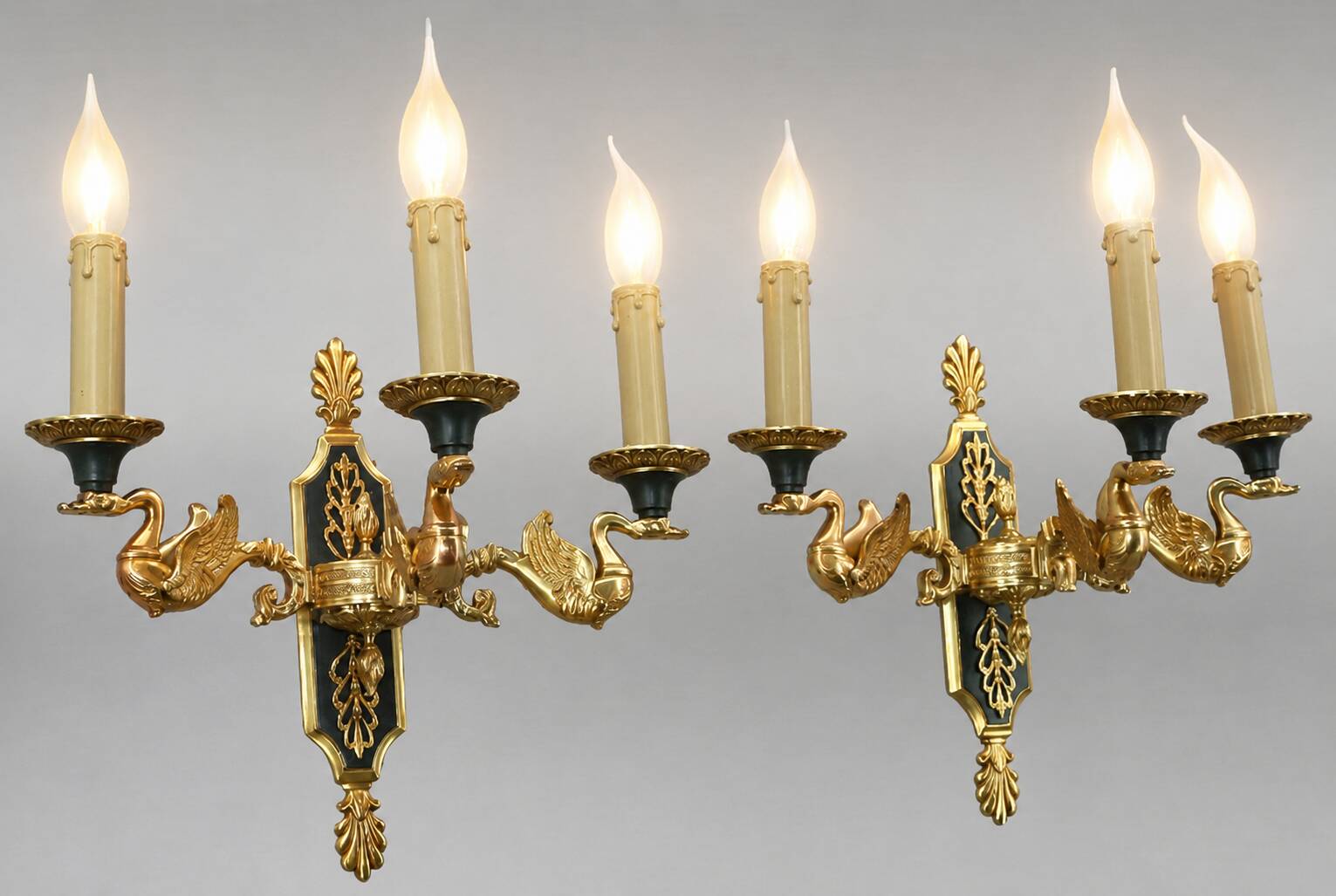 Pair of gold bronze wall lights in Empire style with three lights "Lucien Gau"