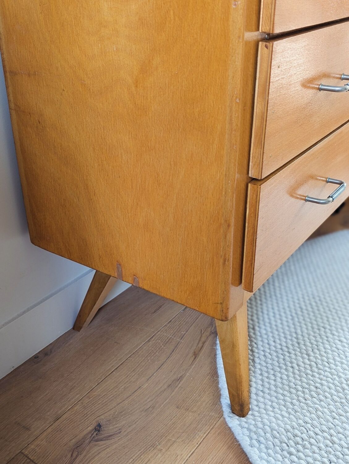 Vintage chest of drawers with tapered legs from the 1960s.