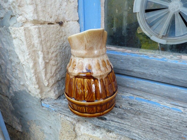 Former wine pitcher in glazed earth style bistrot auberge