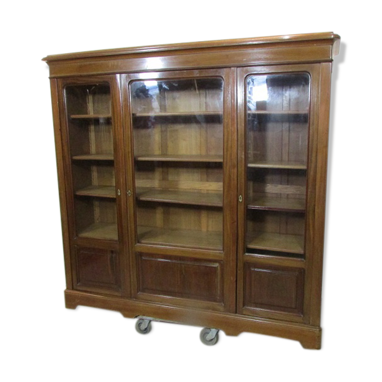 Bibliothèque en cacjou vernie trois portes