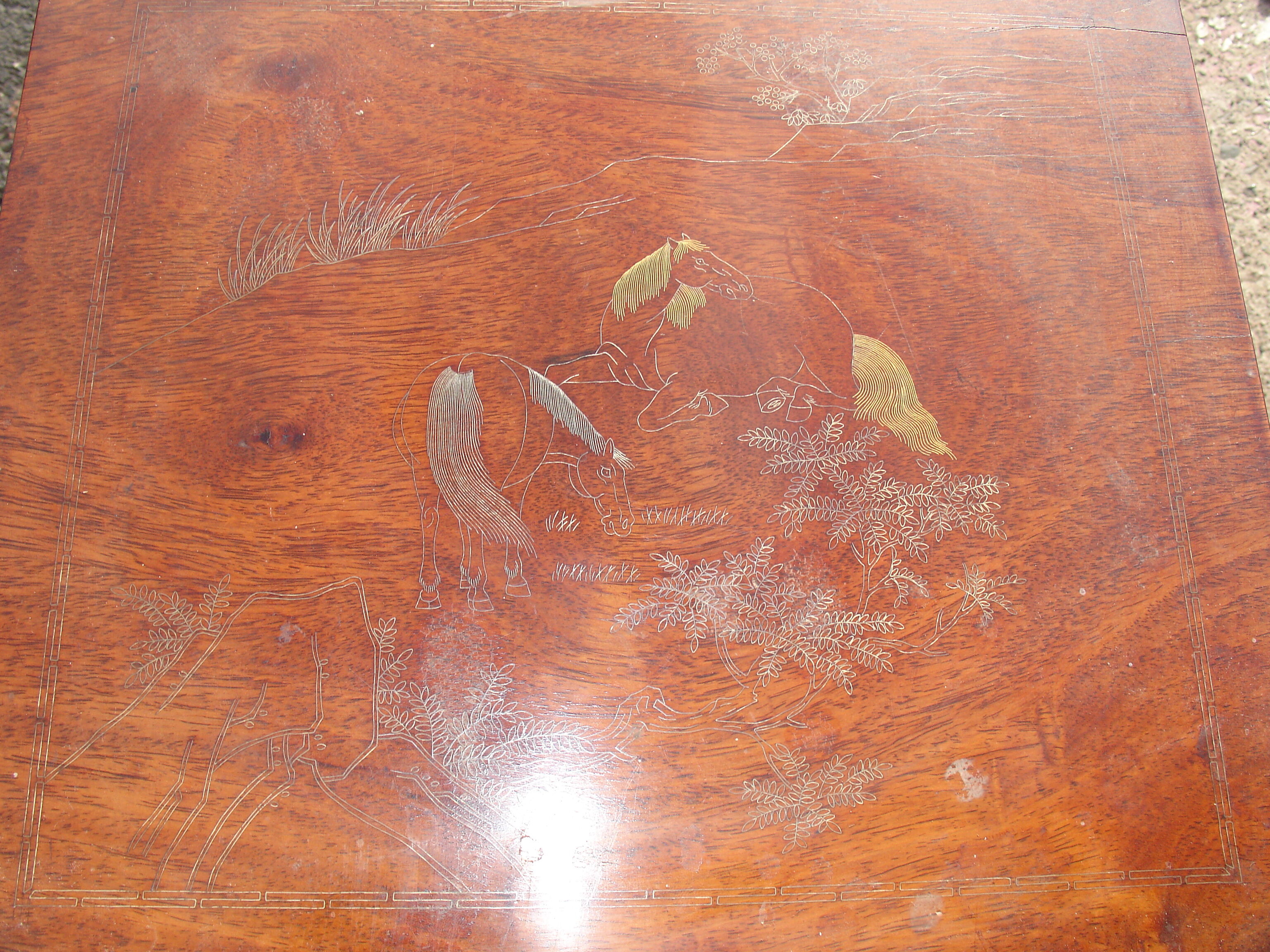 Nesting tables in ironwood with engraved decoration and gold highlights