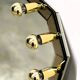 Vintage German brass & smoked mirror with architectural faceted top, 1980s.