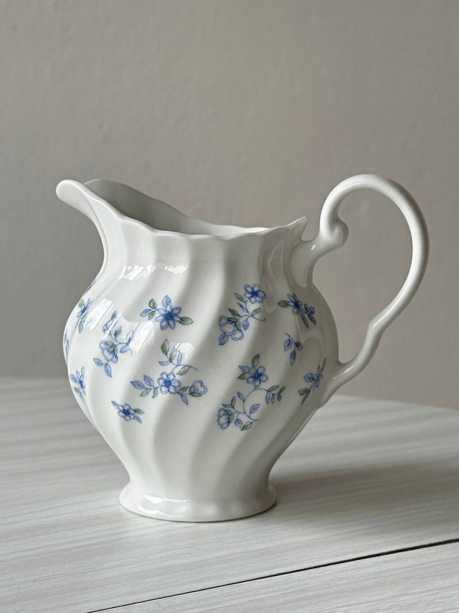 White porcelain creamer with small blue flowers – Milk jug
