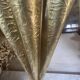 Antique repoussé brass umbrella stand