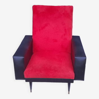 Black leatherette armchair and red fur