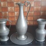 2 pitchers and 1 pewter pitcher