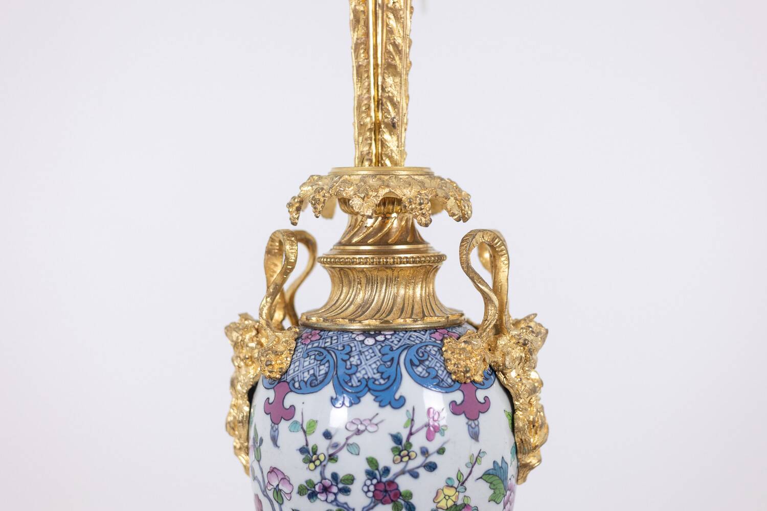 Pair of porcelain lamps decorated with bronze satyrs. Circa 1880.