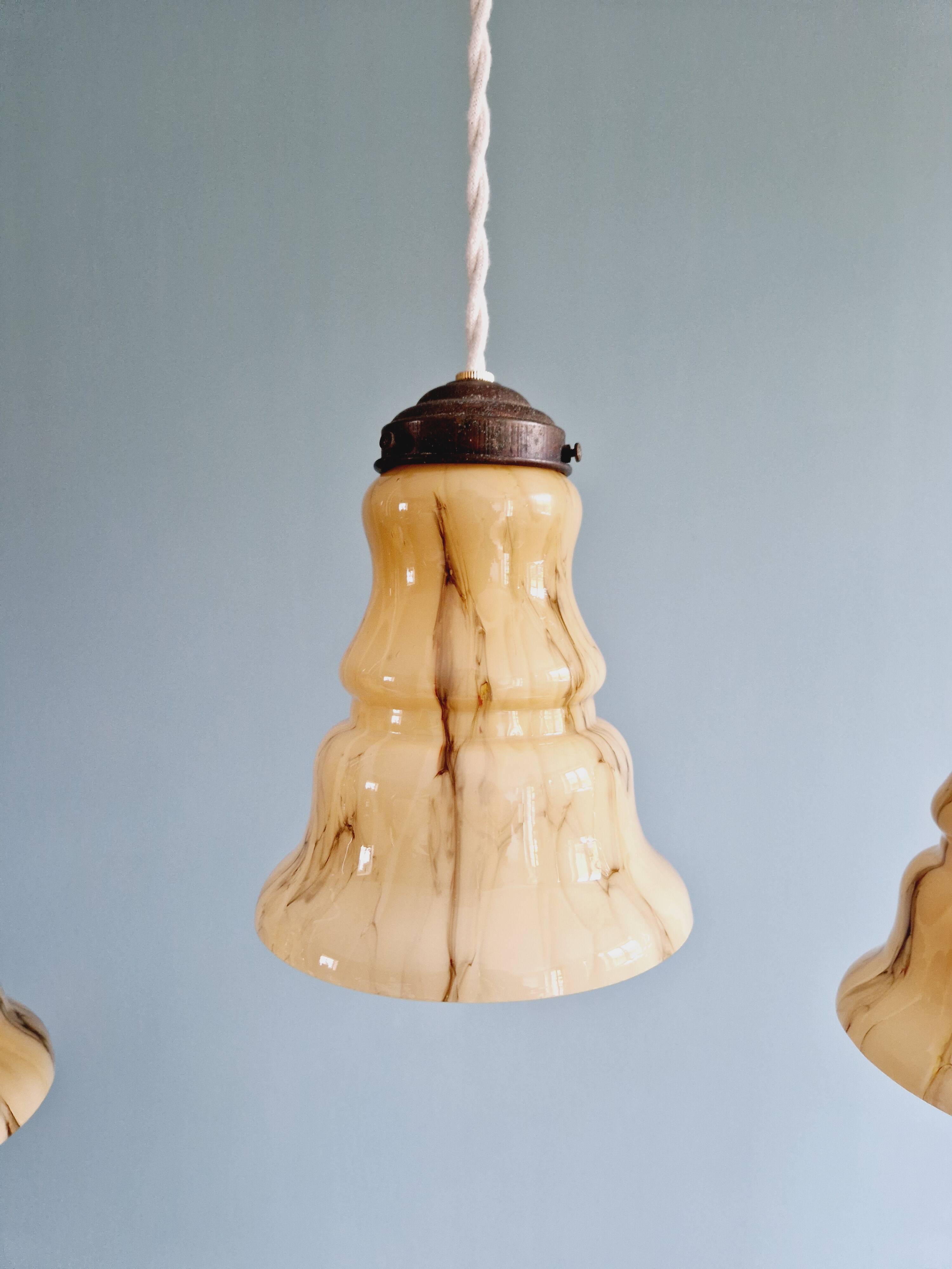 Set of 3 Art Deco marbled opaline pendant lights, 1920s-30s
