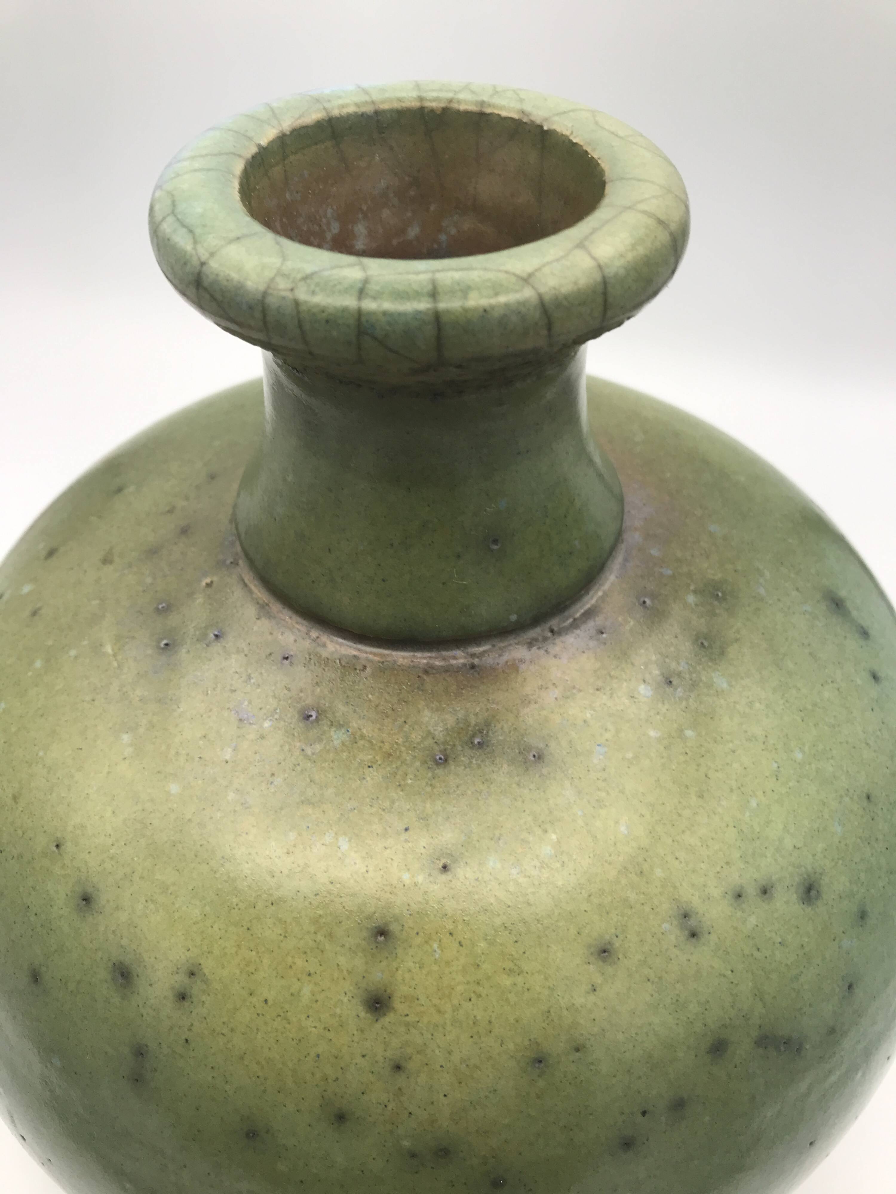 Contemporary vase ball shape raku shades of green and yellow