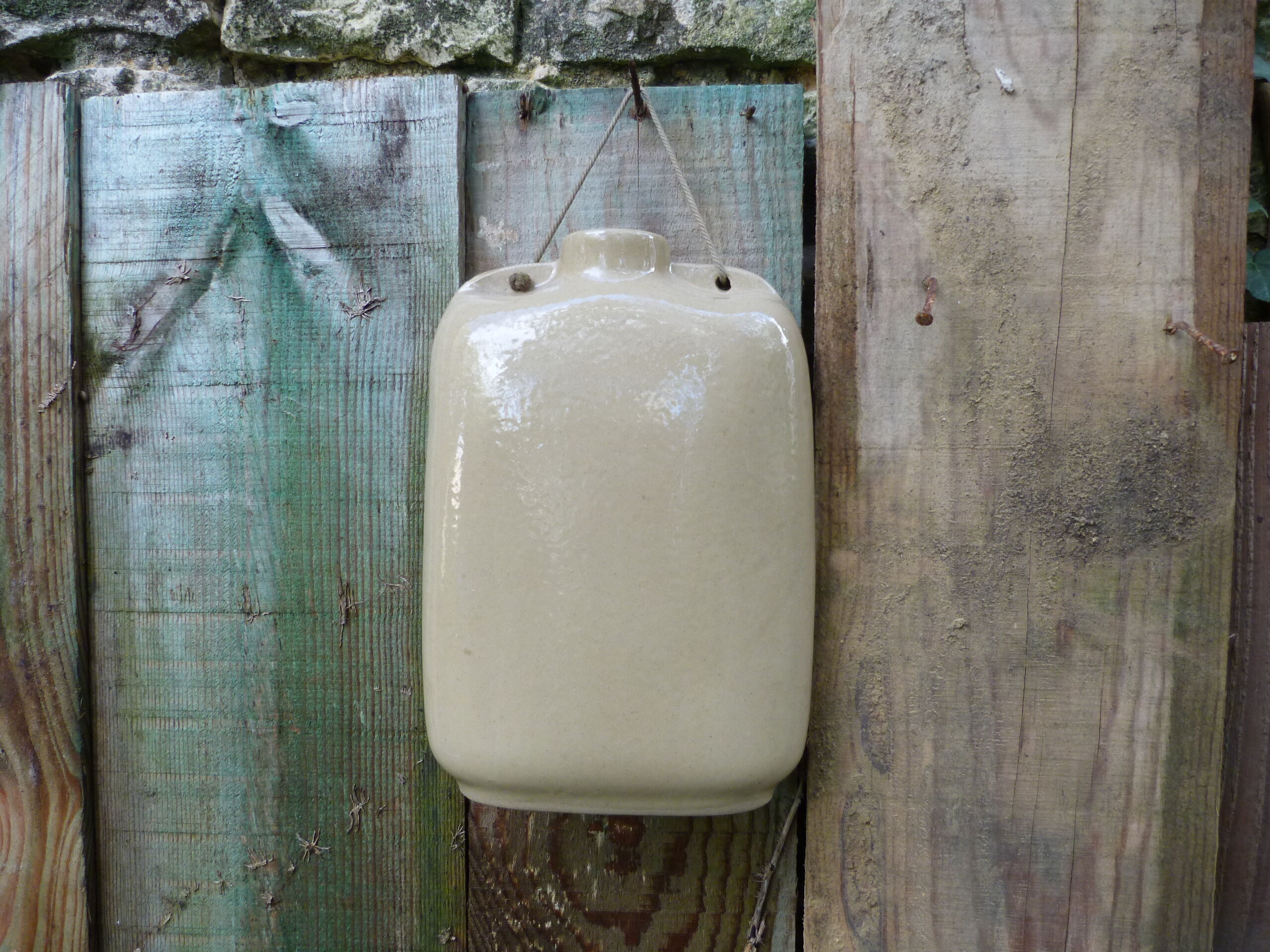 English sandstone hot water bottle dated 1942
